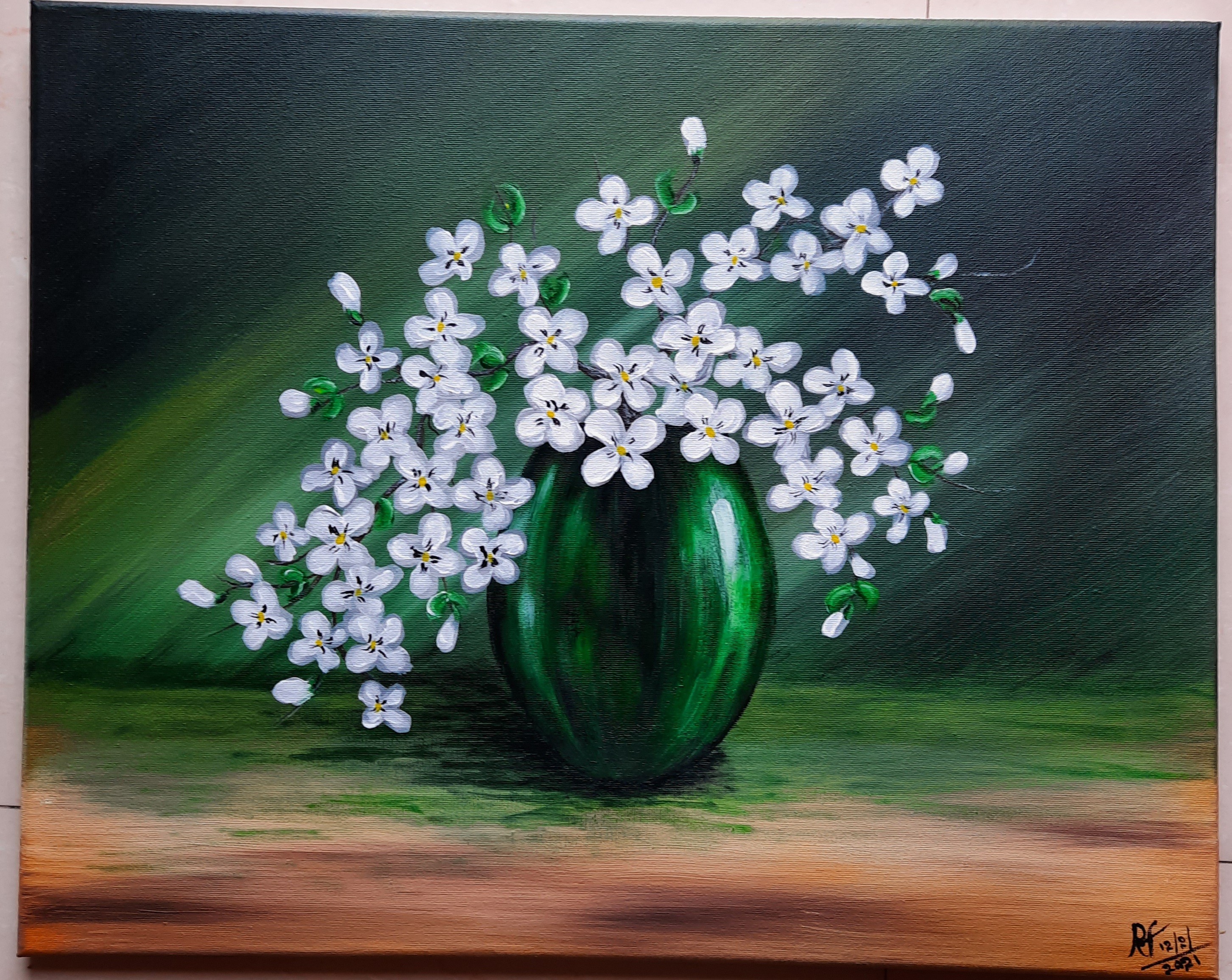 White flowers in a green pot by Roshan Fernando