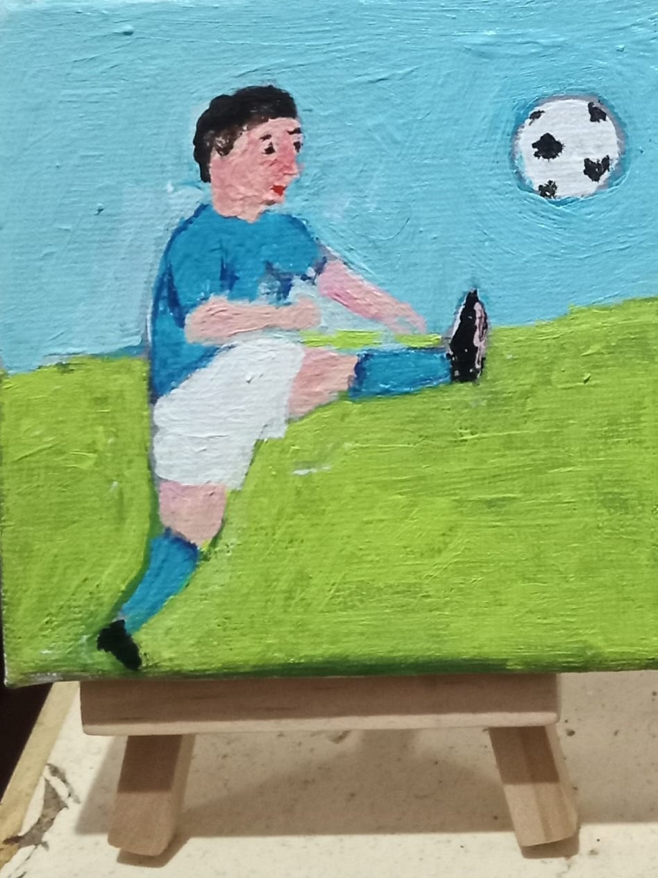 Small Boy who is a Football Player - With stand